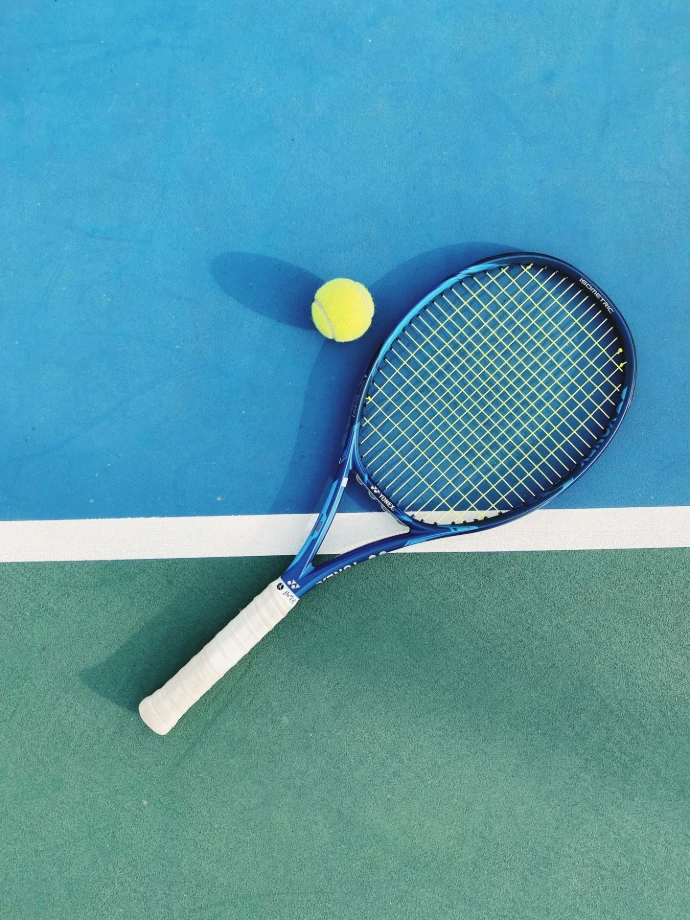 white and blue tennis racket